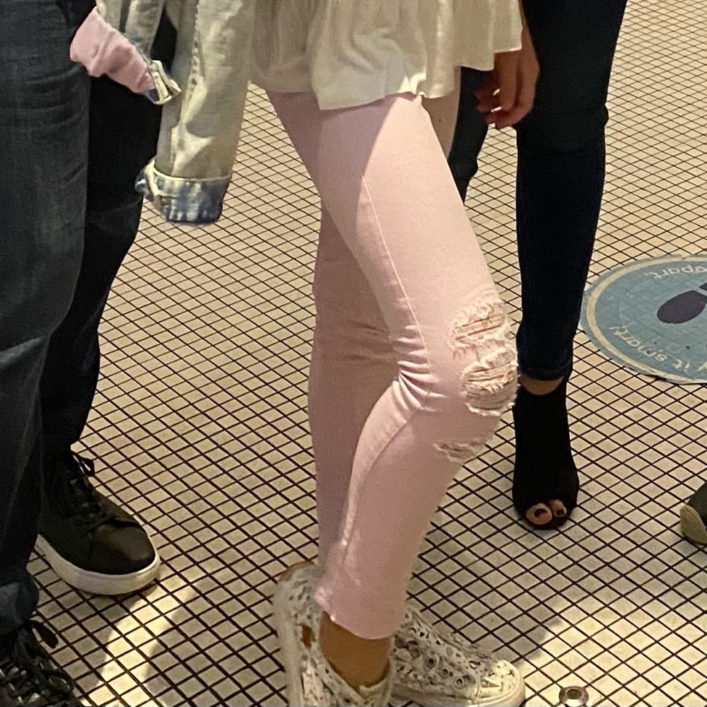 Levi’s distress pink jeans.